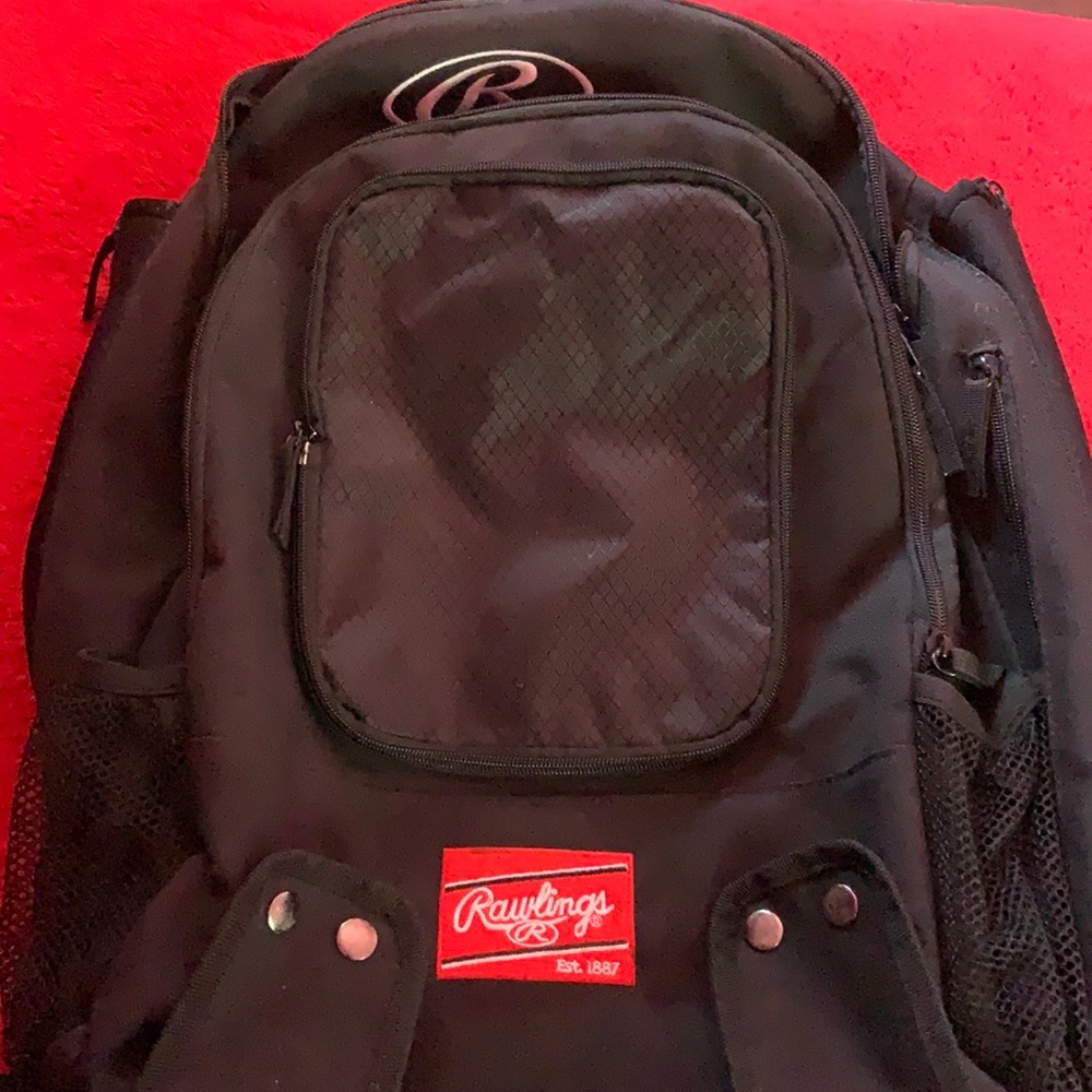 Black Rawlings softball backpack. Multiple zipper.